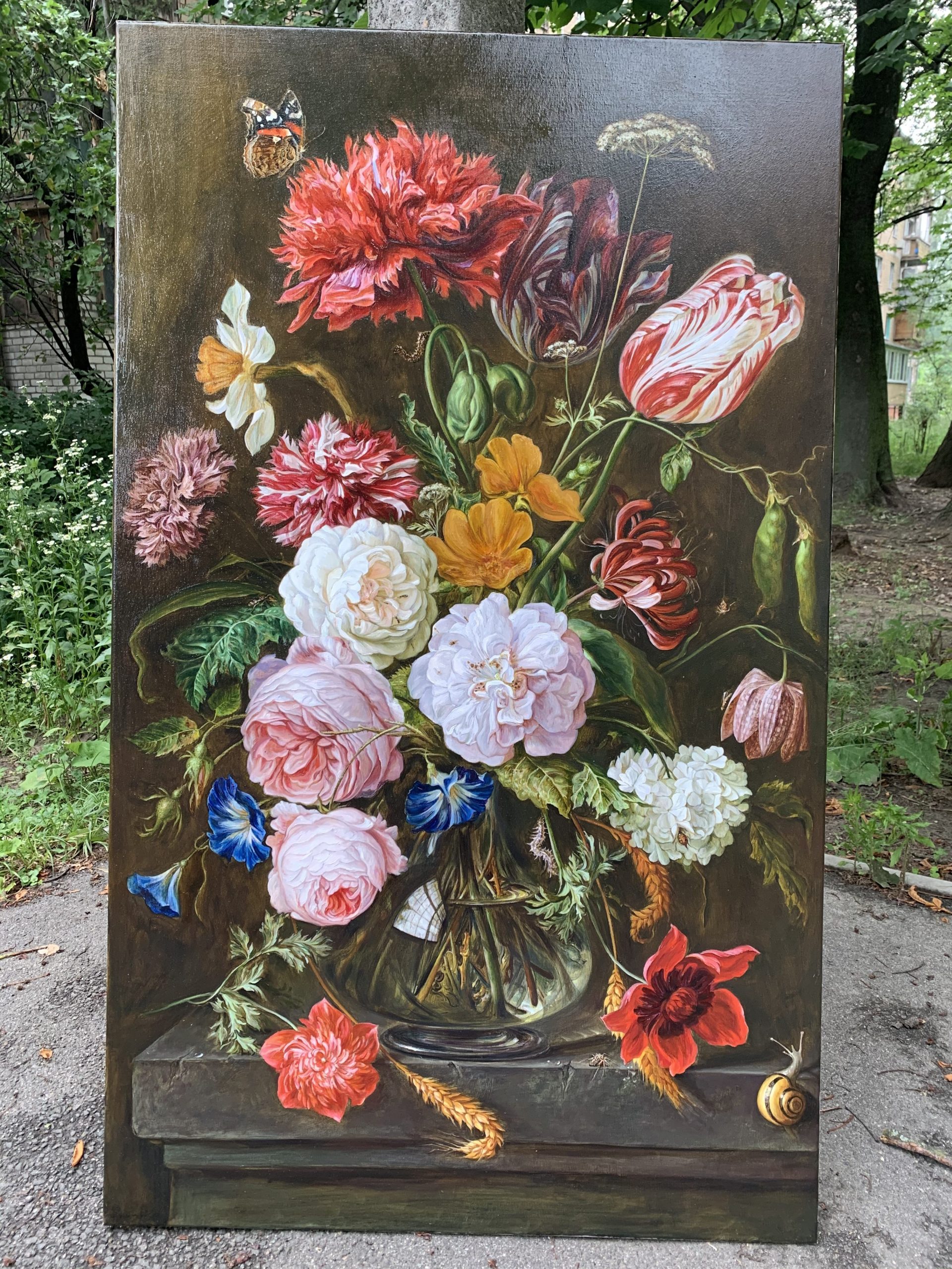 Complete view of classical Dutch style floral still life oil painting with mixed flowers in glass vase