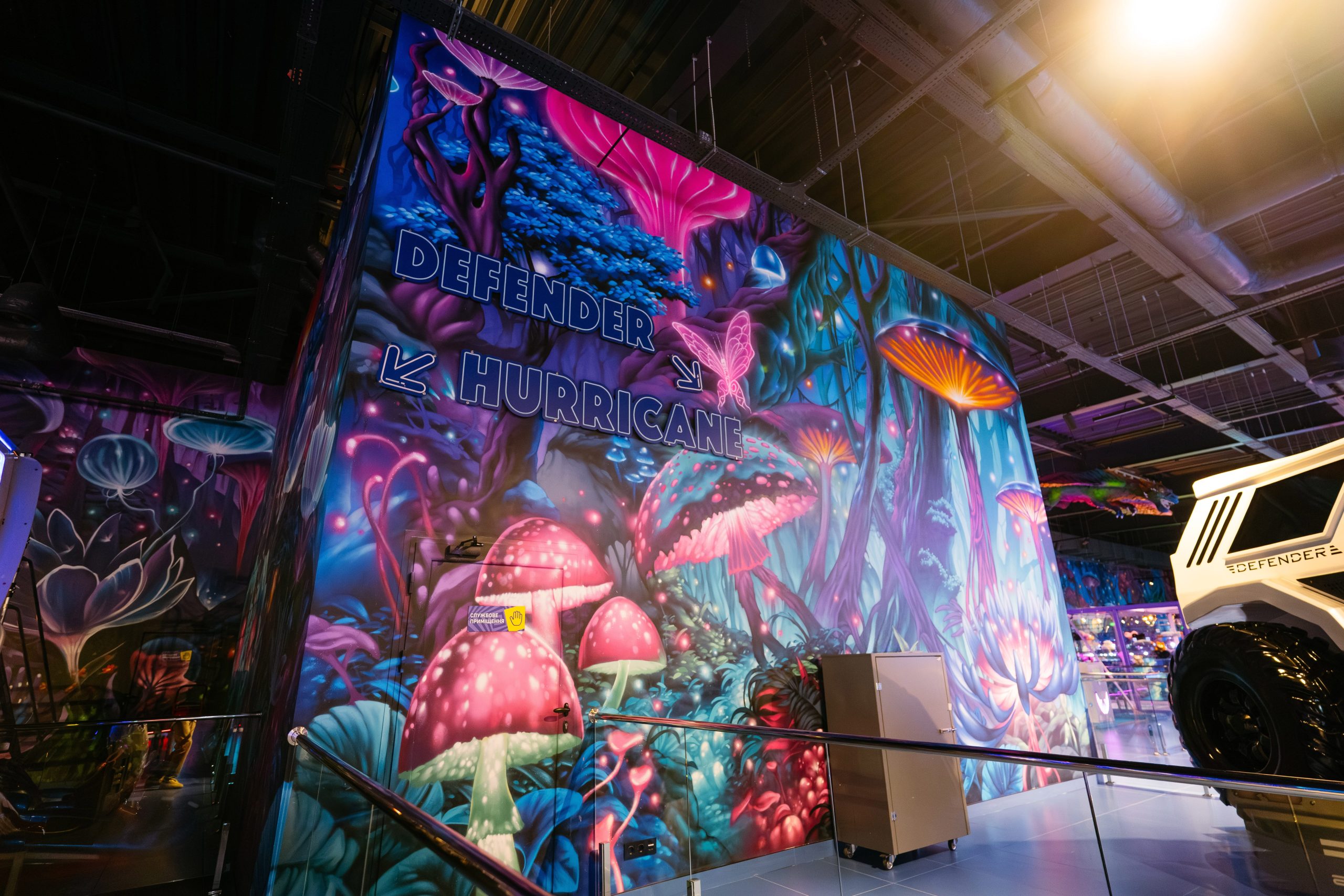 Detailed architectural element with hand-painted luminescent jellyfish and fantasy flora showing professional multi-layered painting technique in commercial venue