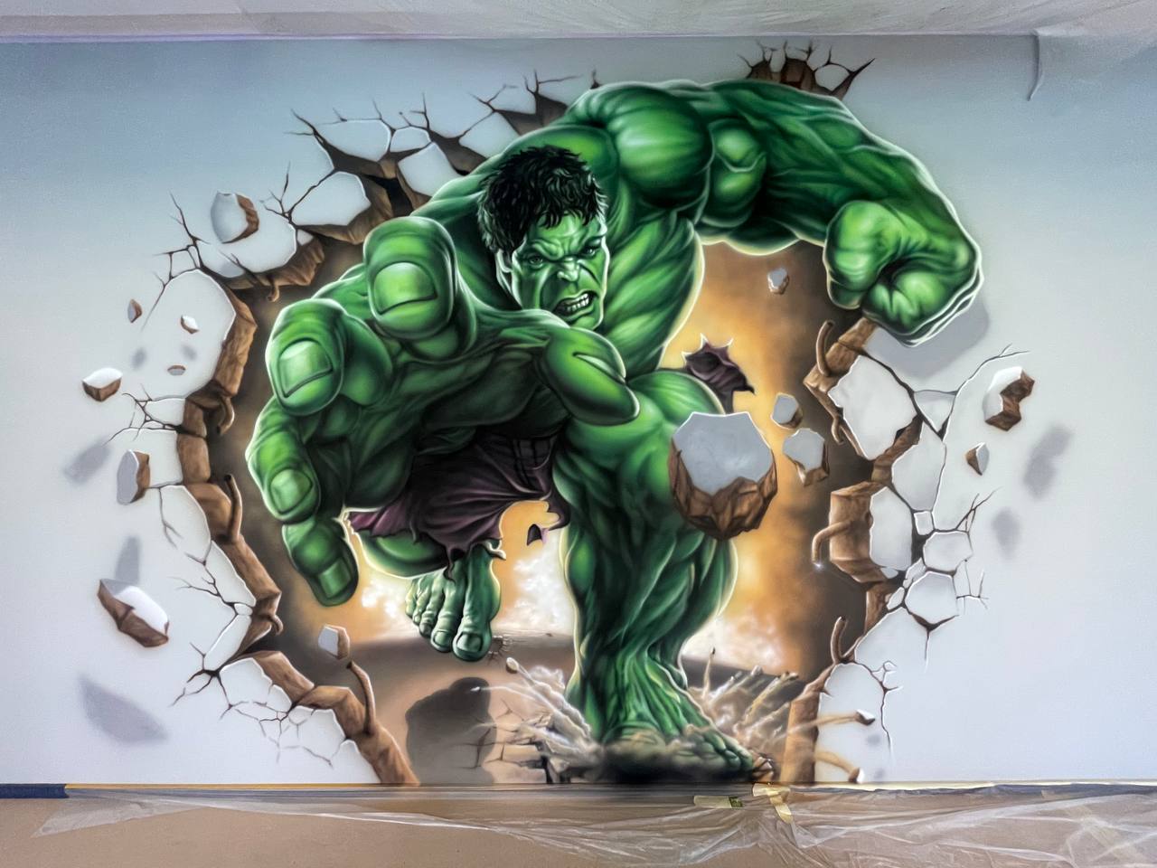 Detailed view of 3D superhero character mural with realistic shading and dimensional effect