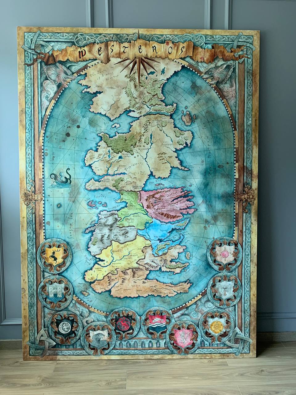 Full view of 2.2 metre hand-painted Westeros map canvas with ornate decorative border and aged parchment style